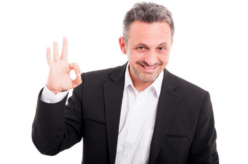 Portait of cool young male doing ok symbol