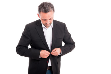 Successful guy dressing up for an appointment