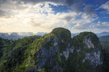 Fototapeta na wymiar high rock mountain with cloud sky sunny landscape.