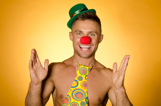 Young sexy clown. Holiday and smiles. 