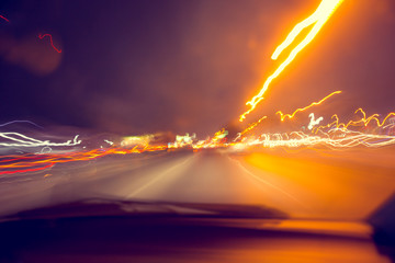 blur hi-power lightning acceleration to high speed on night superhighway road fast moving motion drive with night light trail