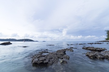 Rock and wave on the Ao Sen beach Phuket Thailand