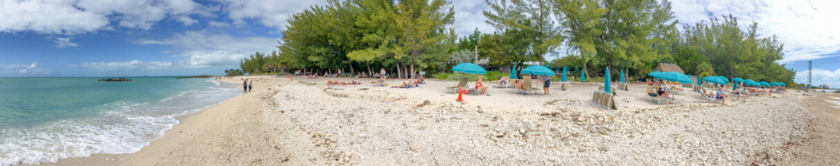 Fototapeta na wymiar KEY WEST, FL - FEBRUARY 2016: Panoramic view of tourists in Fort Zachary Beach. Key West is a major tourist destination in Florida