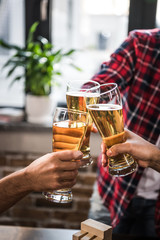 men clinking glasses