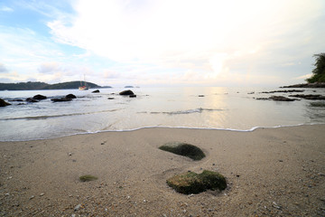 Rock and wave on the Ao Sen beach Phuket Thailand