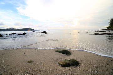 Rock and wave on the Ao Sen beach Phuket Thailand