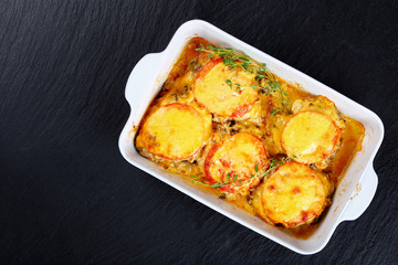meat chops layered with vegetables and cheese