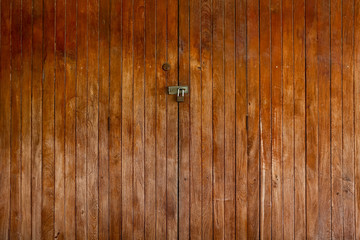old wood locked door. close panel wooden vintage style home door.