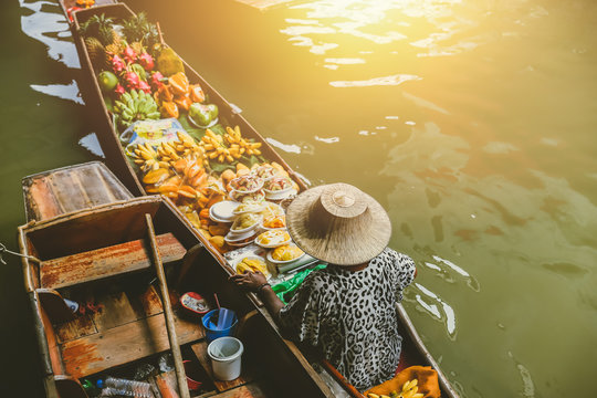 Fruit boat sale at Damnoen Saduak floating market. Damnoen Saduak is a popular travel tourist destination.