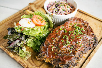 pork bbq ribs with  coleslaw and salad