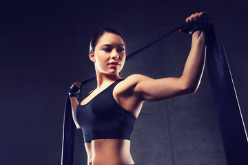 Fototapeta na wymiar woman with expander exercising in gym