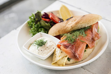 healthy fresh smoked salmon sandwich with egg and sour cream