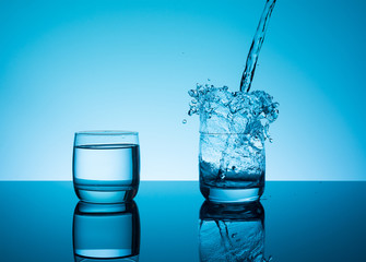 Creative splashing water in the glass