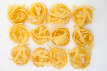 Tagliatelle on white background