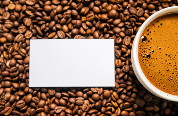 Coffee cup and coffee beans on table, top view, love coffee, Brown coffee beans isolated on white background, Hot Coffee cup with Coffee beans