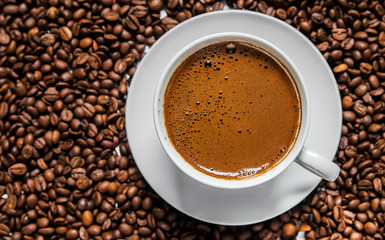Coffee cup and coffee beans on table, top view, love coffee, Brown coffee beans isolated on white background, Hot Coffee cup with Coffee beans