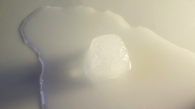 ice cube melting in time lapse