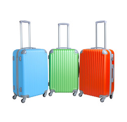Three suitcases isolated on white background. Polycarbonate suitcases isolated on white. Blue, green and red suitcases.
