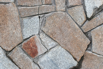 Texture surface of old wall of gray and brown stones