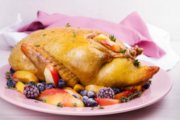 Roast duck with apples and berries