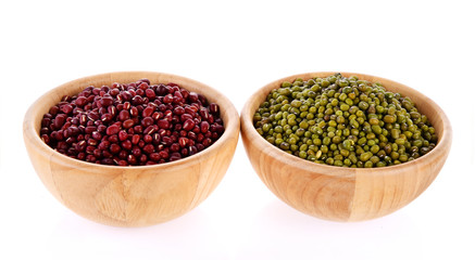 green beans and  red beans, wooden bowls on white background