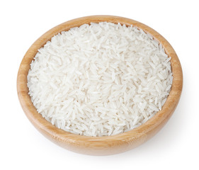 White long-grain jasmine rice in wooden bowl isolated on white background with clipping path
