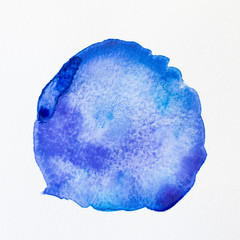 Blue watercolor stain on paper texture. Watercolor blot for design.