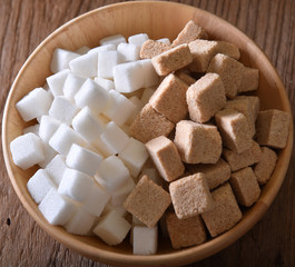 Sugar cubes in wood bowl. Top view.