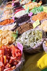Sale of delicious dry fruits on the weekly market, Italy