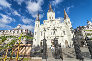 Fototapeta premium NEW ORLEANS, USA - FEBRUARY 2016: Tourists along Jackson Square. New Orleans attracts 10 million tourists annually