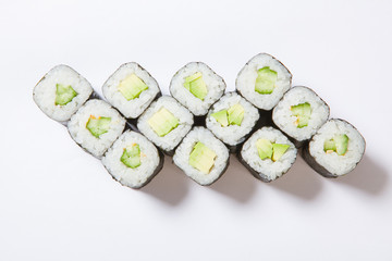 A plate with different kinds of sushi and rolls