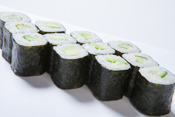 A plate with different kinds of sushi and rolls