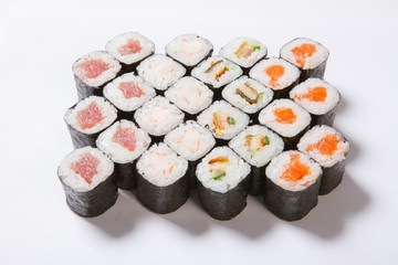 A plate with different kinds of sushi and rolls