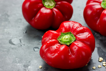 Juicy ripe red pepper with water drops
