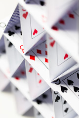 house of playing cards over white background