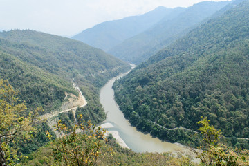 Naklejka na ściany i meble An awesome treat for the nature lovers is to view river Rangeet meet river Teesta from ‘Triveni- viewpoint’. The confluence of Rangeet and Teesta takes place before the Teesta Bridge.