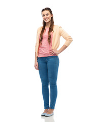 happy smiling young woman in cardigan and jeans