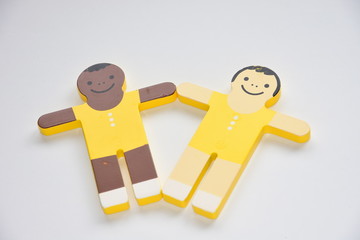 Caucasian and black in peace with wooden toys