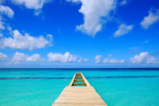 Perspective view of a wooden pier on the caribbean sea.