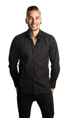 Handsome man in black shirt and black jeans, standing against a white background feeling great and comfortable with a smile.