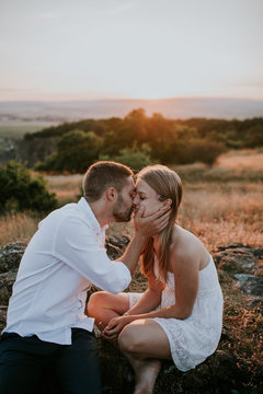 Man kissing young woman