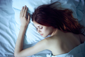 Fototapeta premium the woman put her hand on the pillow, quiet sleep
