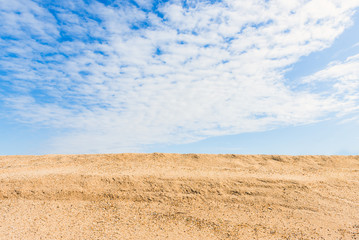 Fototapeta na wymiar Blue sky and yellow sand