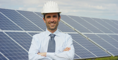 A portrait technical expert in solar photovoltaic panels, remote control performs routine actions...