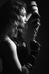Black and white portrait of a beautiful sexy and domineering woman, she plays in the BDSM mistress....