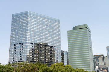 Obraz na płótnie Canvas Modern city skyline from street level. Business and technology concept