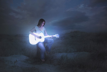 Glowing guitar at night
