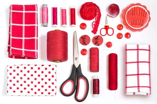 Various sewing accessories and tools red shades