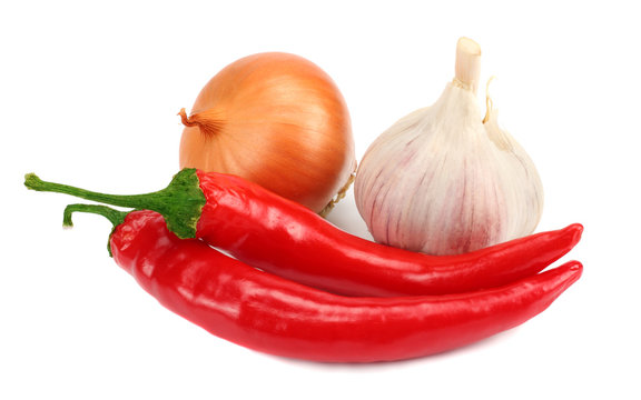 spices onion, garlic and chili pepper isolated on white background