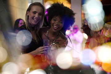 Two women having fun on a party